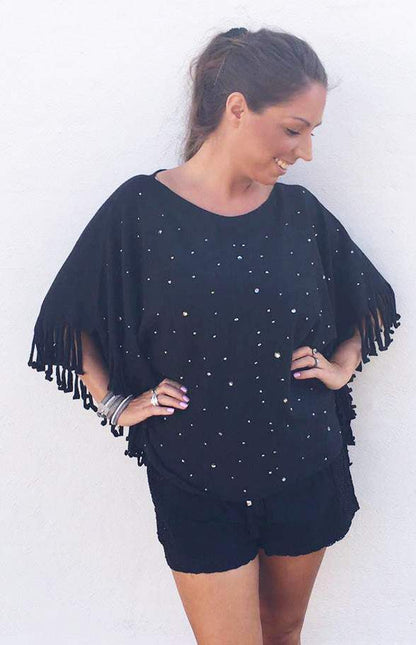 Poncho med glitter i sort