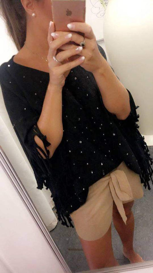 Poncho med glitter i sort